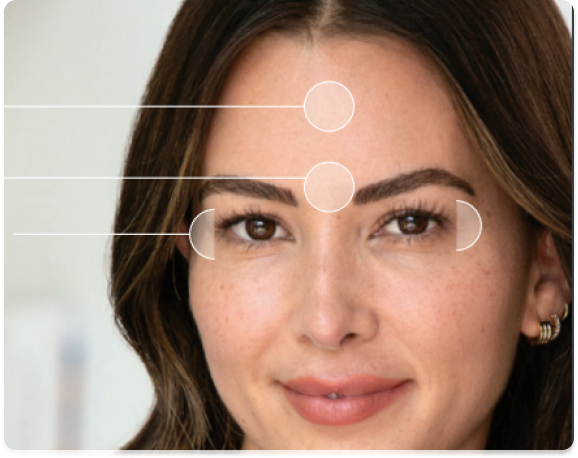 A woman’s face highlighting key areas around the eyes with circles and brackets for emphasis.