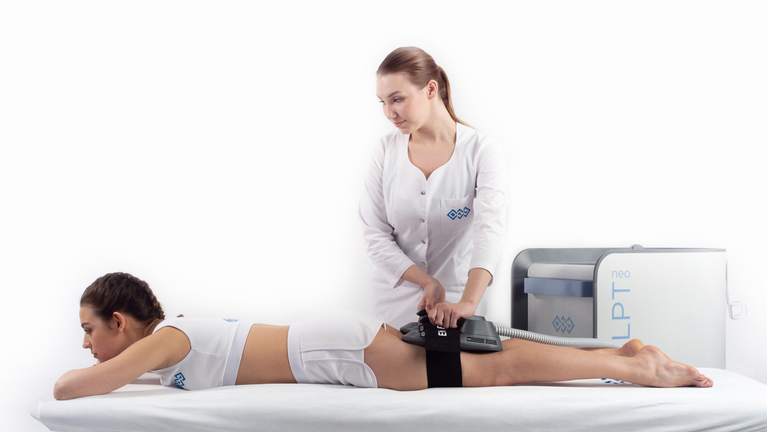A medical professional using an LPLT device on a patient’s knee during therapy.