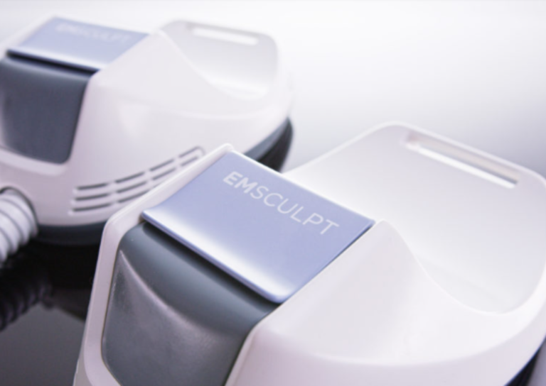 EMSculpt device with labeled handle for muscle stimulation therapy.